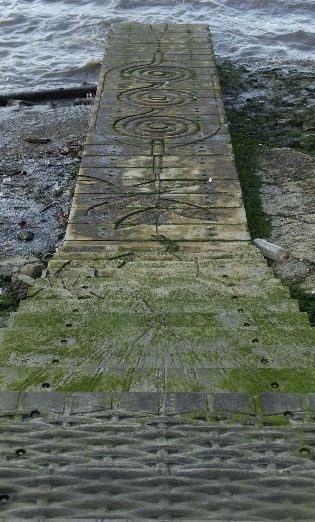 Picture of carved jetty celebrating international cables
